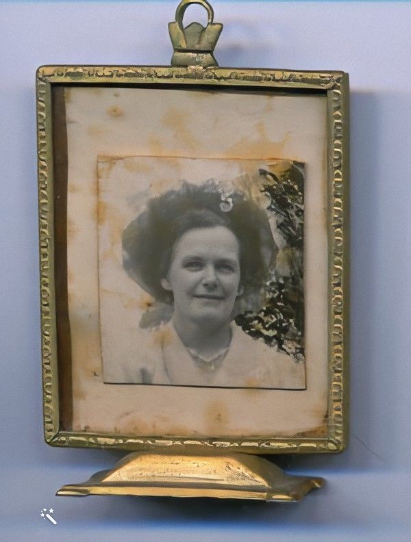 Headshot of Bertha in a gold frame