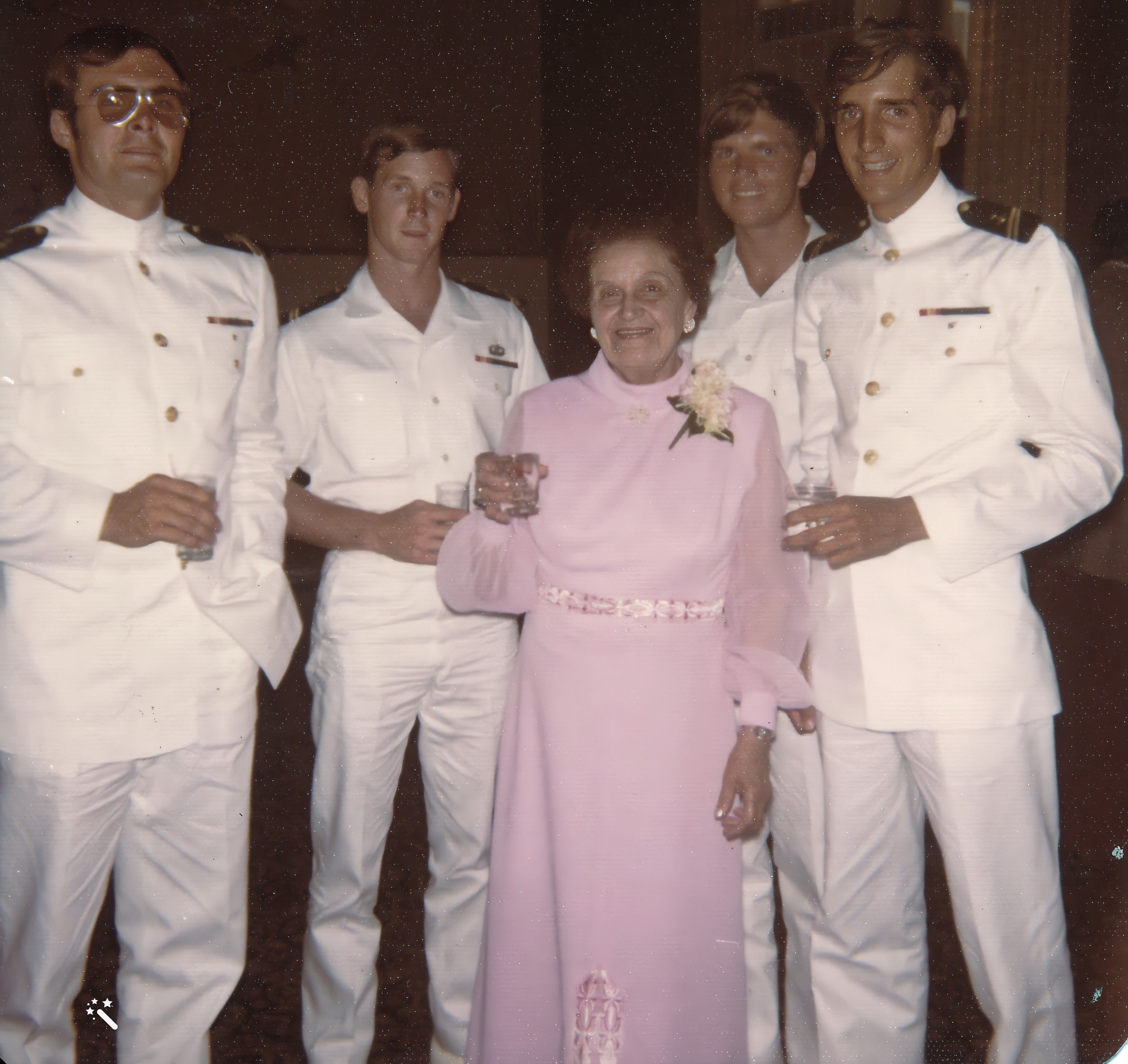 Edith with some young men at the wedding reception